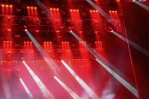 Illuminated empty concert stage with smoke and rays of light